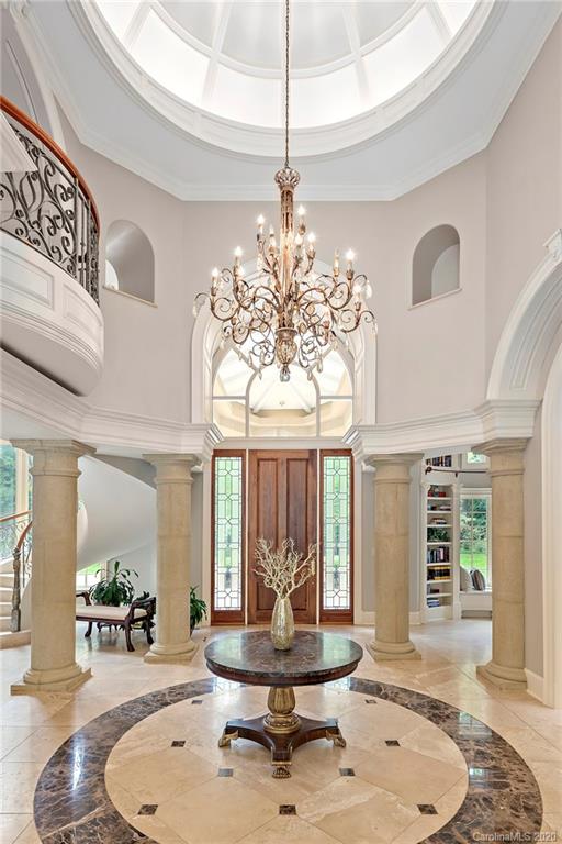 8333 Providence Road Charlotte, NC 28277 - Photo 6 of 47 a living room with couch and a chandelier