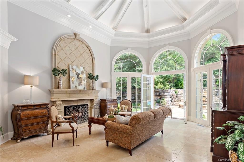 8333 Providence Road Charlotte, NC 28277 - Photo 9 of 47 a living room with furniture a fireplace and a large window