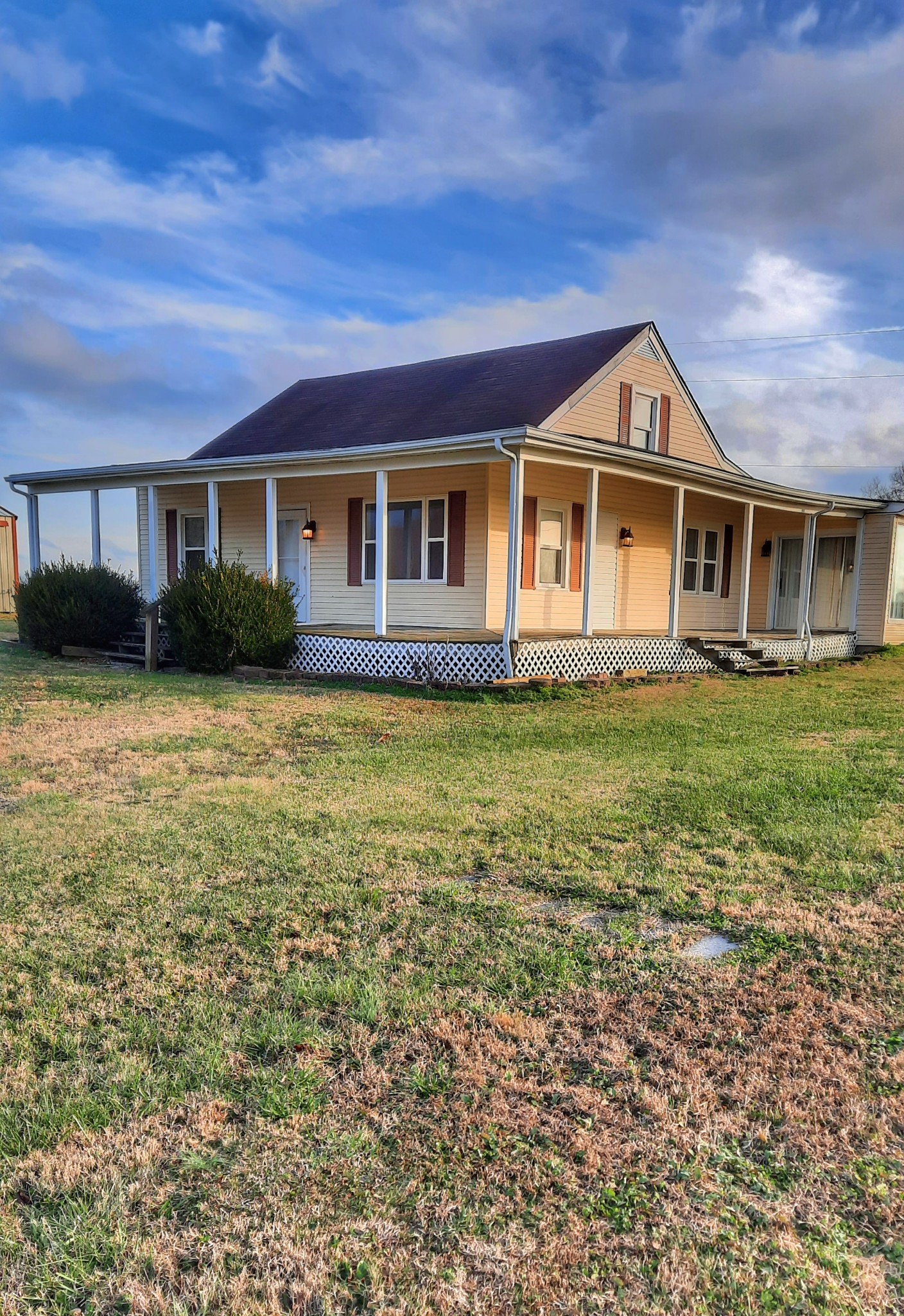 966 Denning Ford Road Portland, TN 37148 - Photo 1 of 7 a front view of a house with a garden