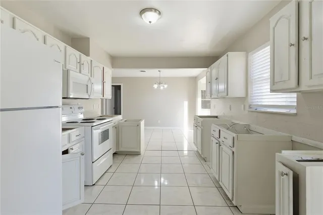 a view of a kitchen with appliances