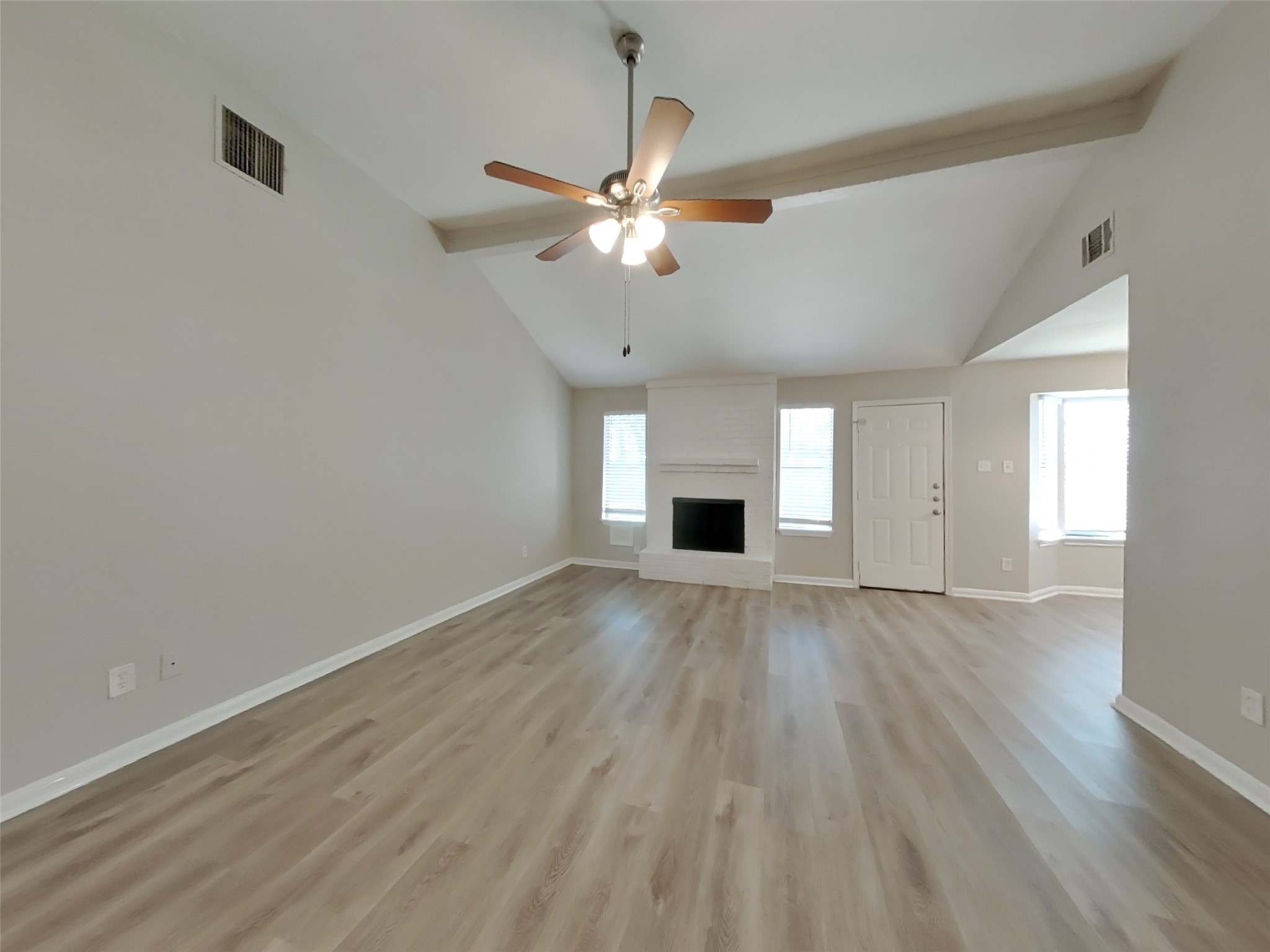 3815 Shadow Trail Houston, TX 77084 - Photo 2 of 16 wooden floor in an empty room with a window