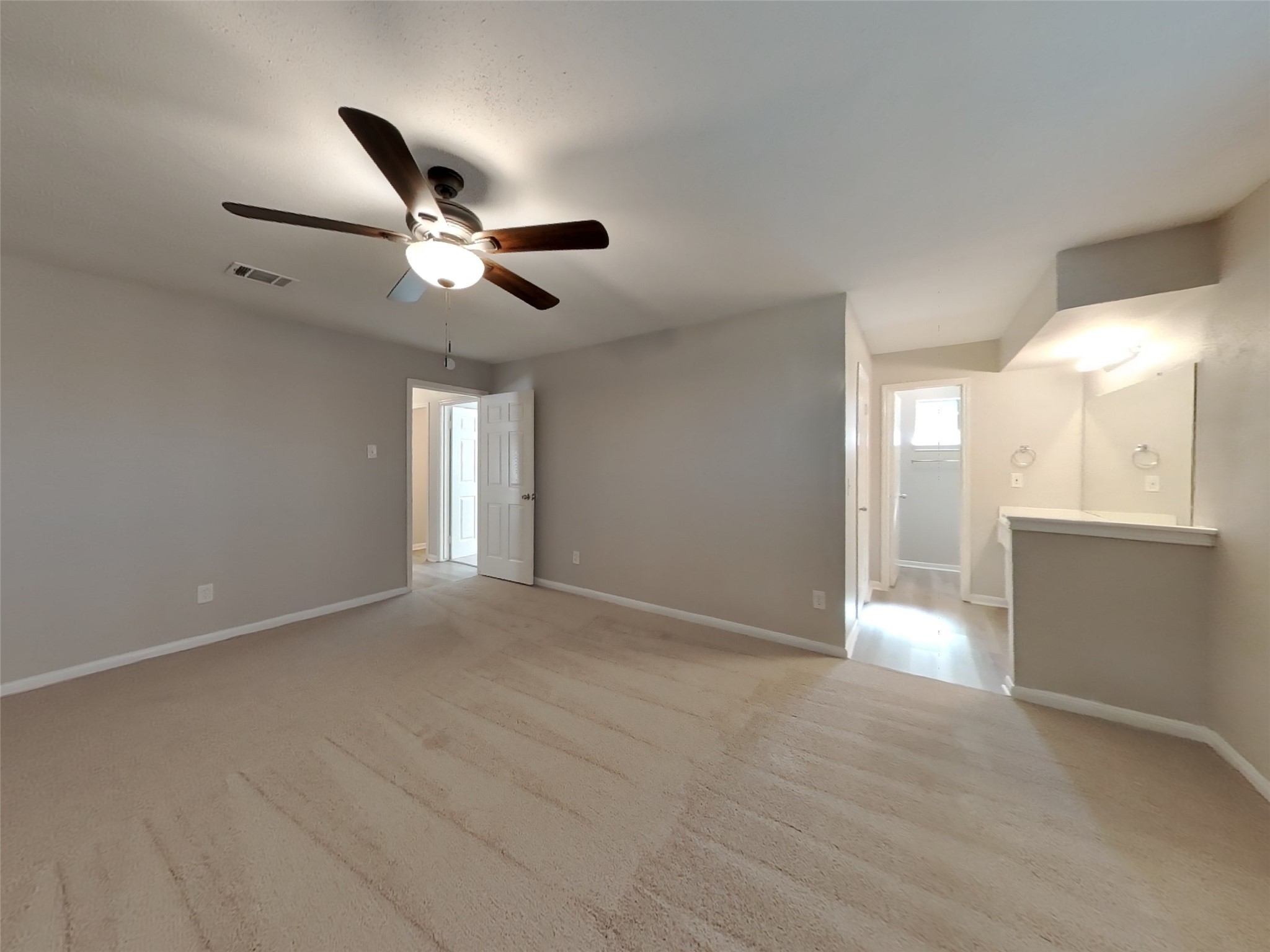 3815 Shadow Trail Houston, TX 77084 - Photo 6 of 16 a view of an empty room with a ceiling fan