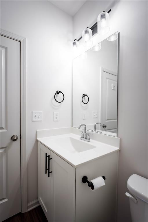 709 Needletail Way Atlanta, GA 30312 - Photo 12 of 29 a bathroom with a sink mirror vanity and toilet