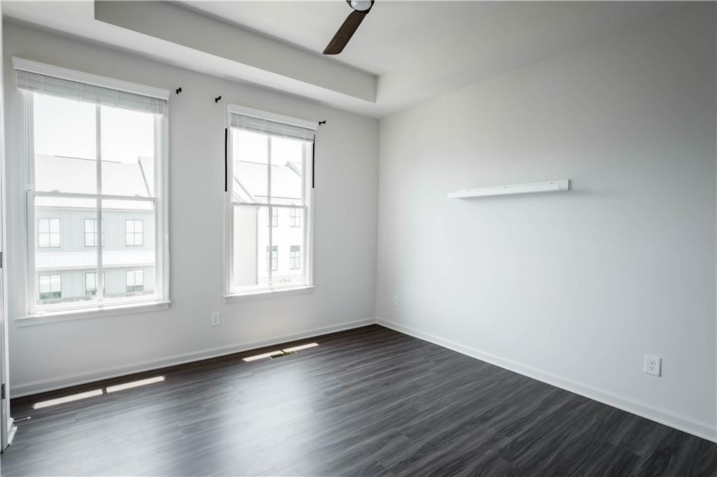 709 Needletail Way Atlanta, GA 30312 - Photo 15 of 29 an empty room with wooden floor and windows