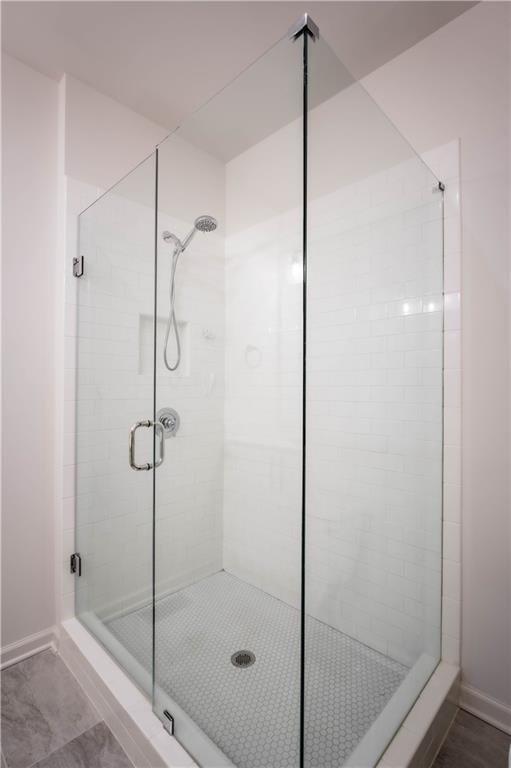 709 Needletail Way Atlanta, GA 30312 - Photo 18 of 29 a bathroom with a shower