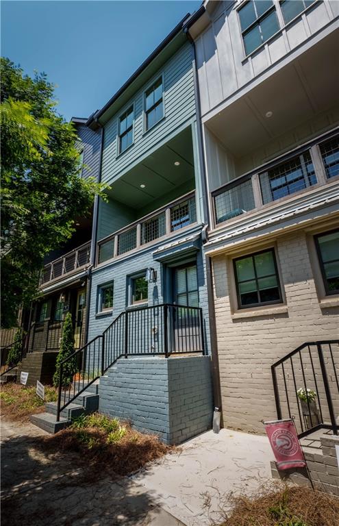 709 Needletail Way Atlanta, GA 30312 - Photo 22 of 29 a front view of a house with a balcony