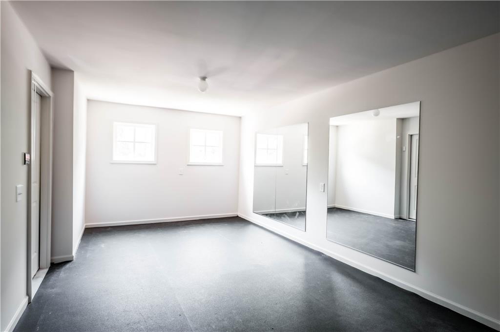 709 Needletail Way Atlanta, GA 30312 - Photo 5 of 29 an empty room with windows and closet