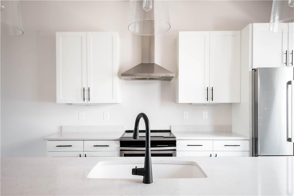 709 Needletail Way Atlanta, GA 30312 - Photo 10 of 29 a kitchen with a sink and cabinets