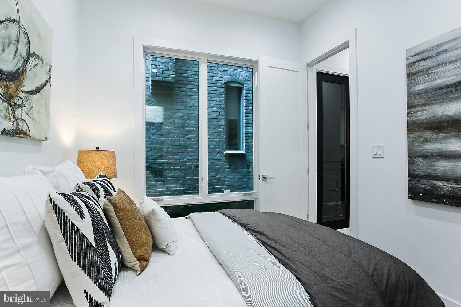 4 R Street Northwest, Unit 3 Washington, DC 20001 - Photo 21 of 28 a bedroom with a bed and walk in closet