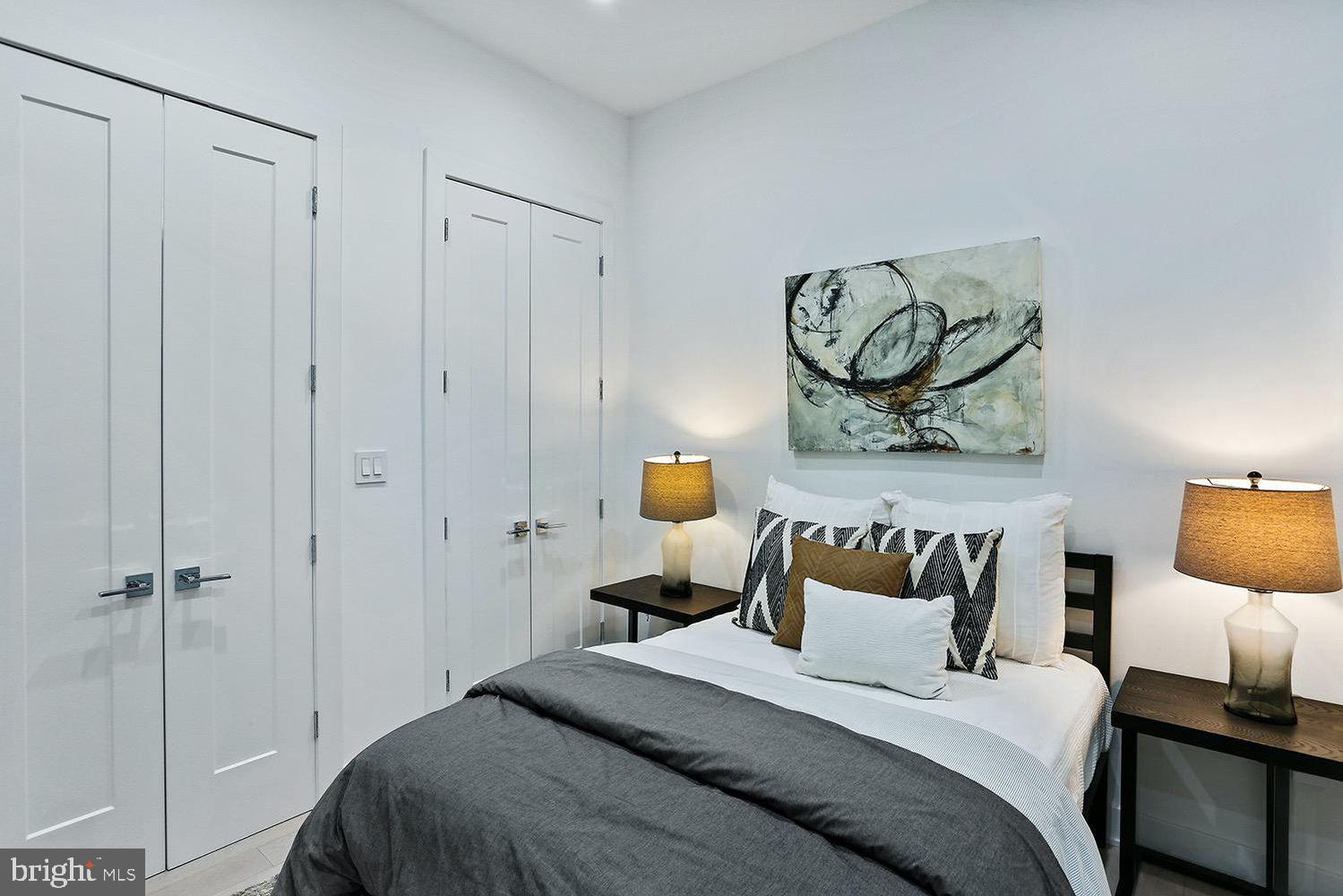 4 R Street Northwest, Unit 3 Washington, DC 20001 - Photo 23 of 28 a bedroom with a bed and a chandelier