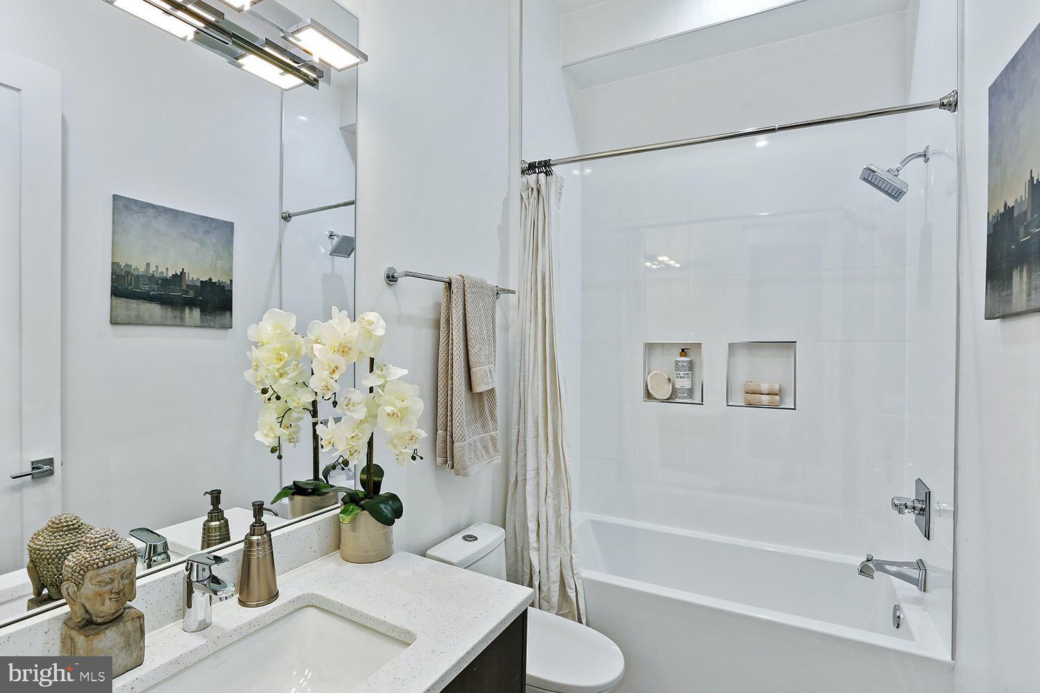 4 R Street Northwest, Unit 3 Washington, DC 20001 - Photo 27 of 28 a bath room with toilet and shower