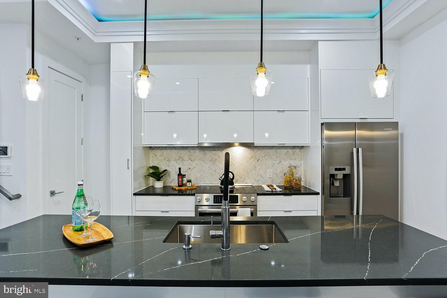 4 R Street Northwest, Unit 3 Washington, DC 20001 - Photo 9 of 28 a kitchen with sink and refrigerator