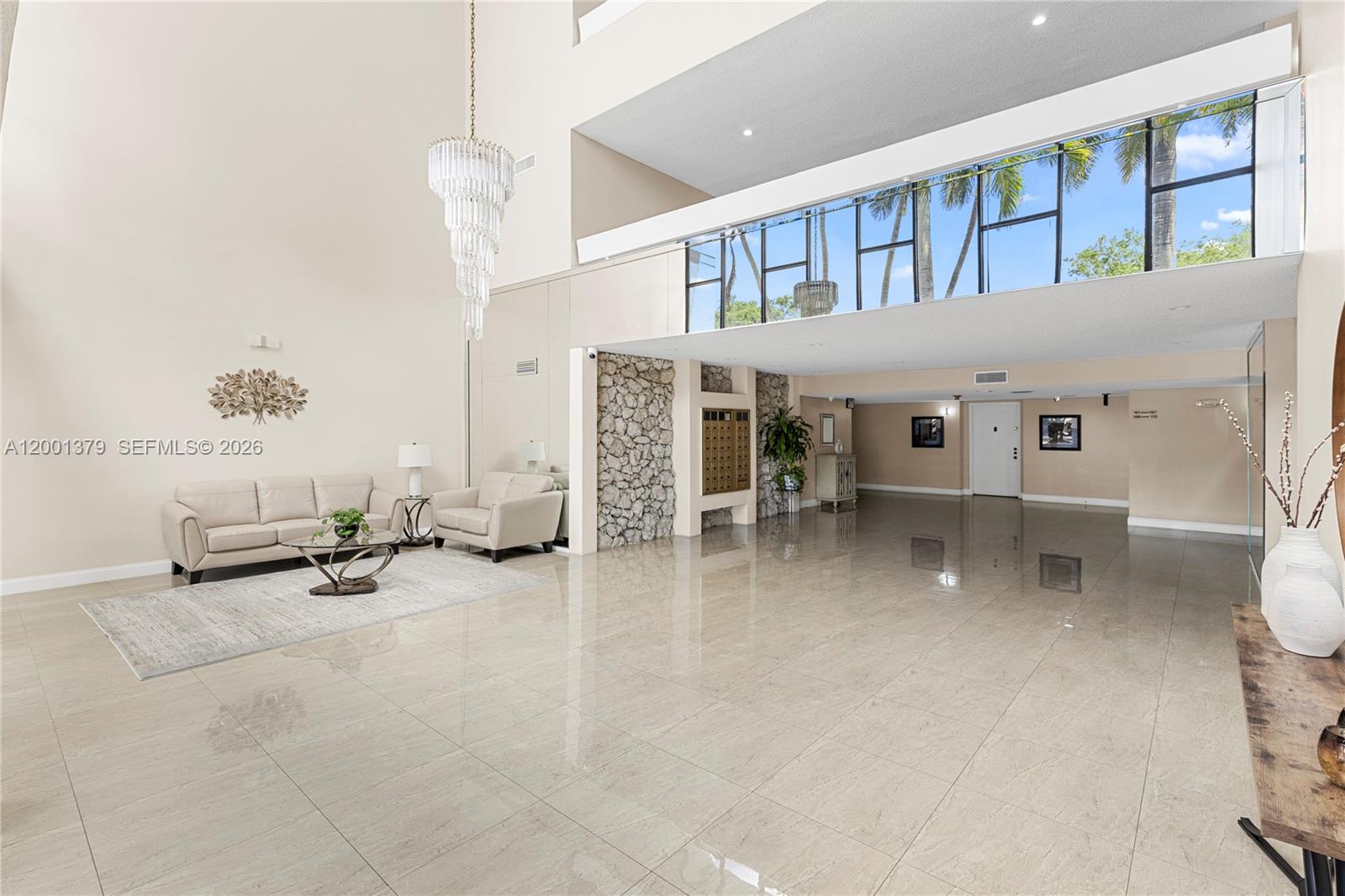 16251 Golf Club Road, Unit 311 Weston, FL 33326 - Photo 3 of 38 a view of a livingroom with furniture and a ceiling fan