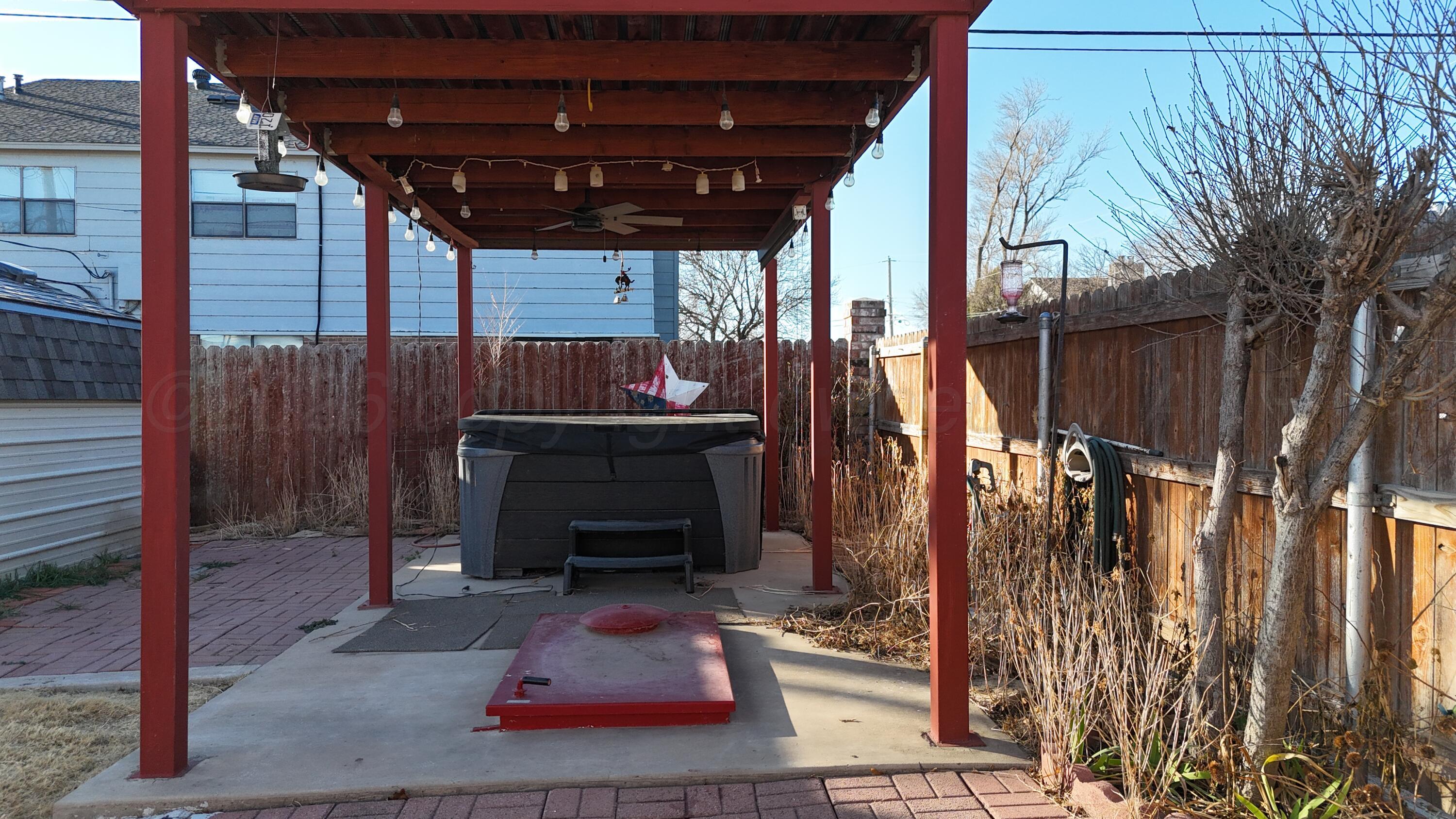 2100 13th Avenue Canyon, TX 79015 - Photo 4 of 11 a patio with table and chairs with potted plants