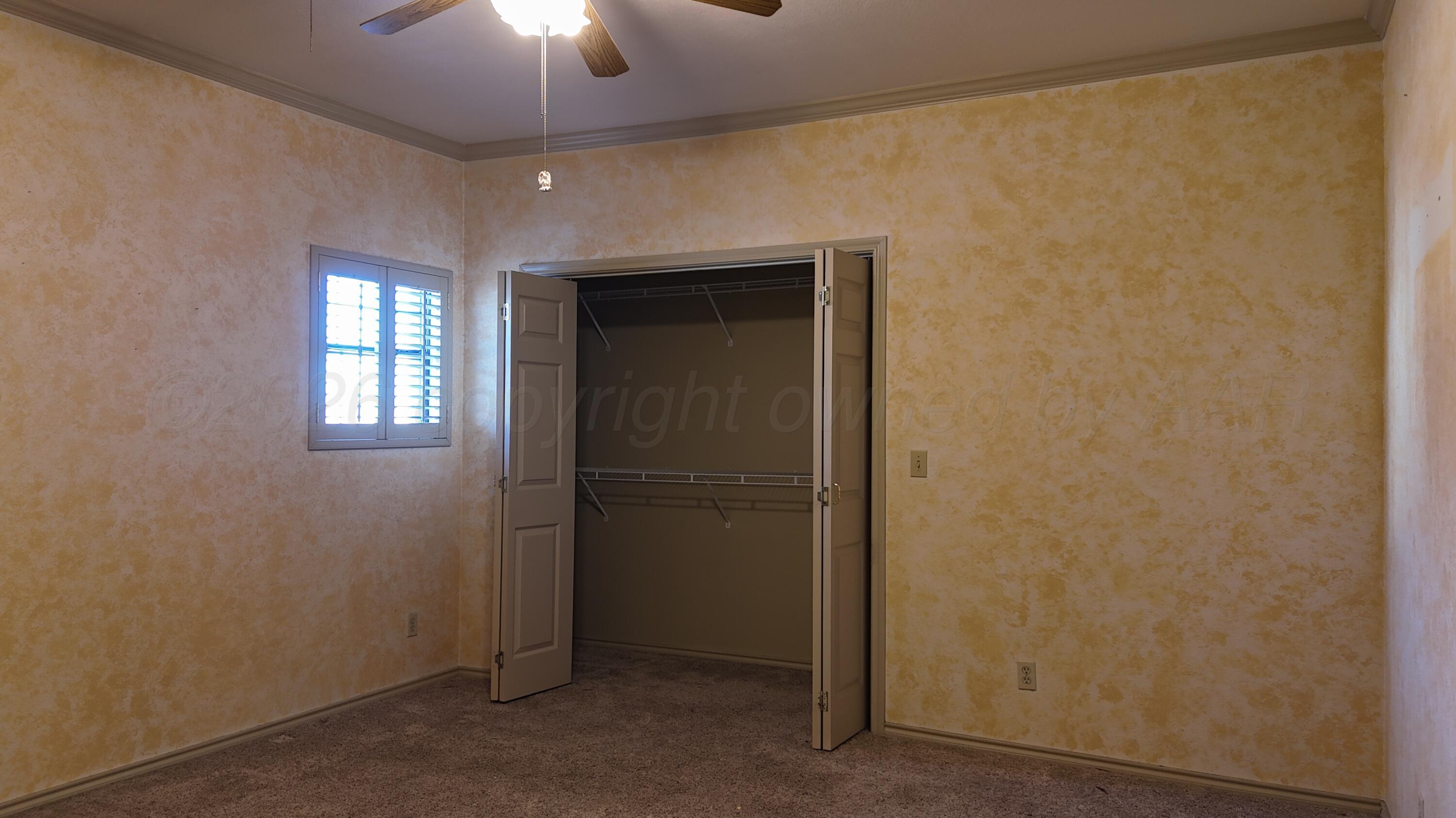 2100 13th Avenue Canyon, TX 79015 - Photo 8 of 11 a view of an empty room with a window