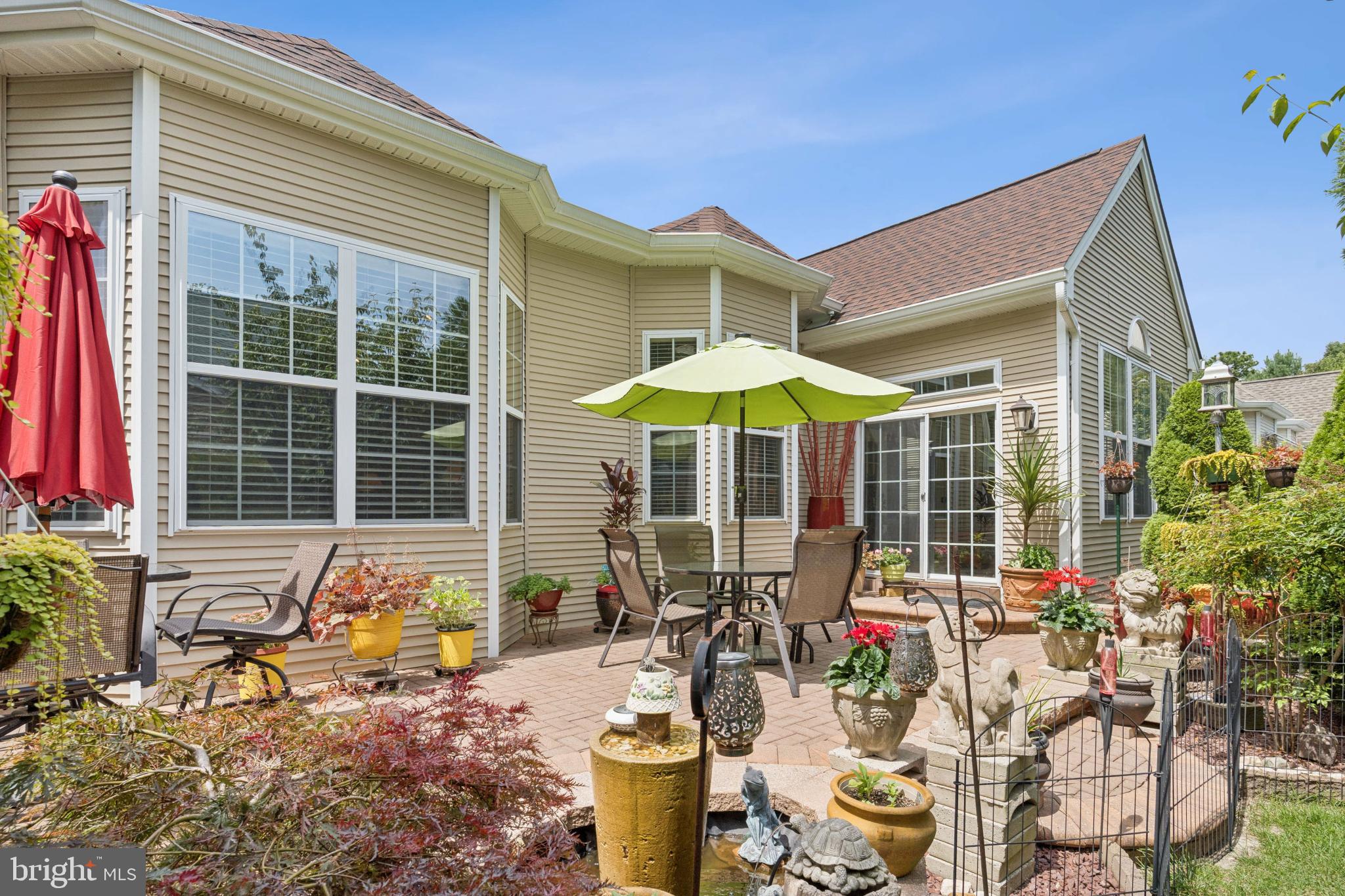 4 Running Brook Terrace Barnegat, NJ 08005 - Photo 24 of 28 Charming patio oasis with vibrant greenery.