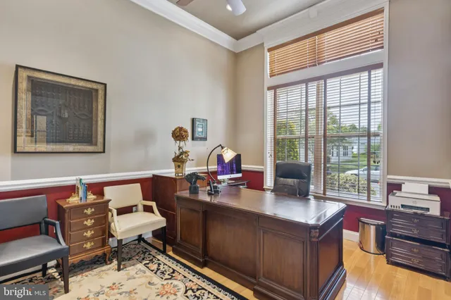 a work room with furniture and a window