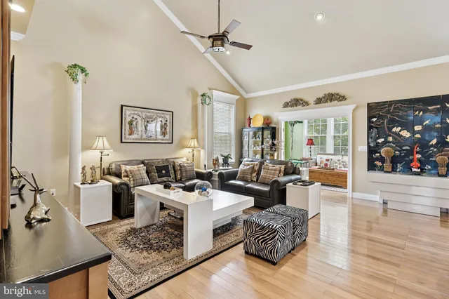 a living room with furniture or couch and a wooden floor