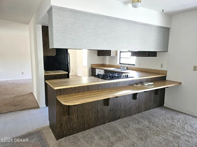 a kitchen with stainless steel appliances granite countertop a stove and a sink