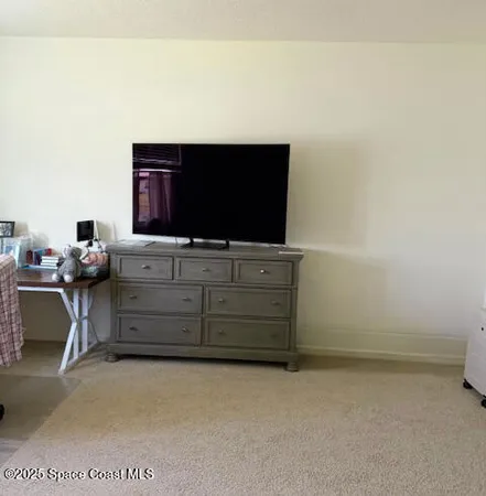 a room with furniture and flat screen tv