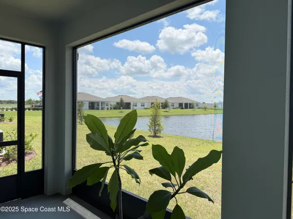 a view of a balcony with furniture
