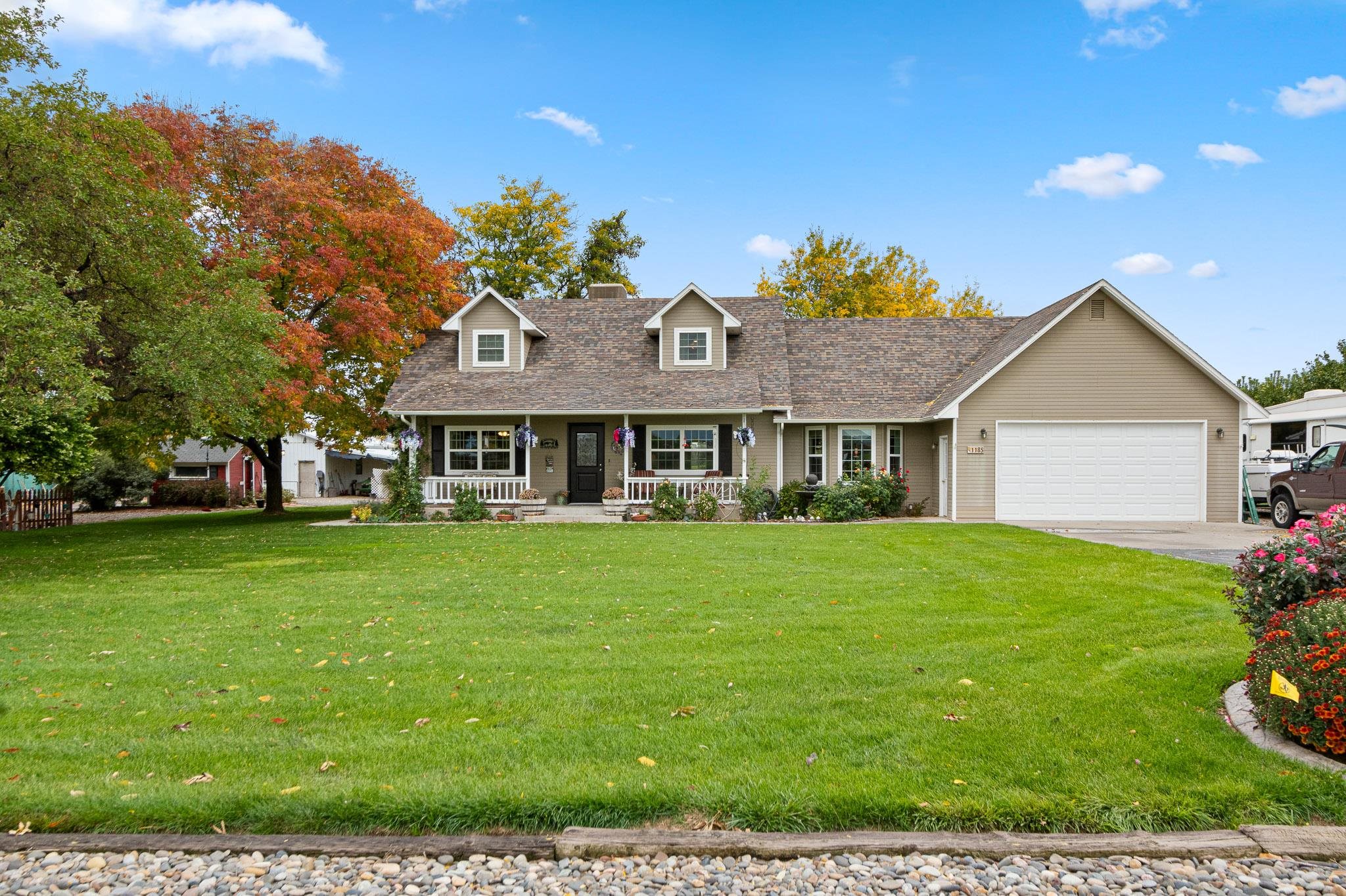 a front view of a house with a garden
