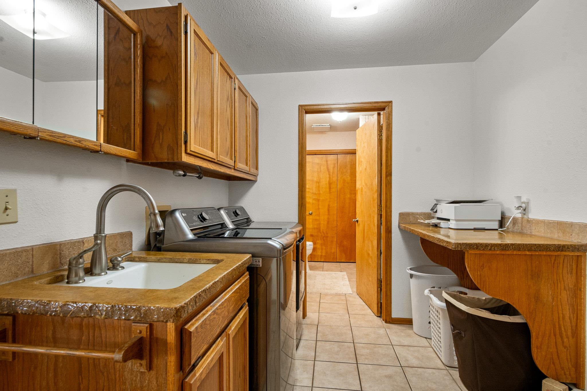 1185-17 17 1/2 Road Fruita, CO 81521 - Photo 13 of 35 a kitchen with stainless steel appliances granite countertop a sink a stove and a refrigerator