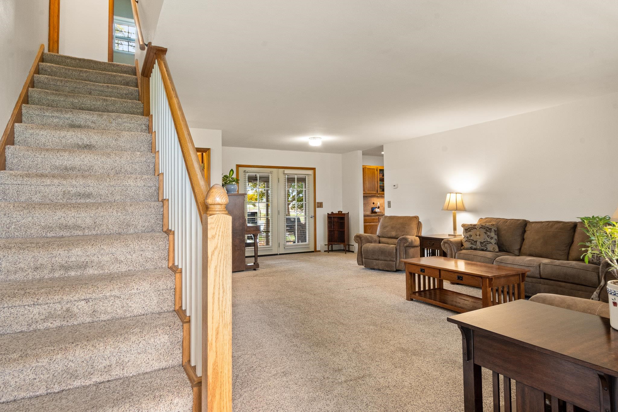 1185-17 17 1/2 Road Fruita, CO 81521 - Photo 5 of 35 a living room with furniture and stairs