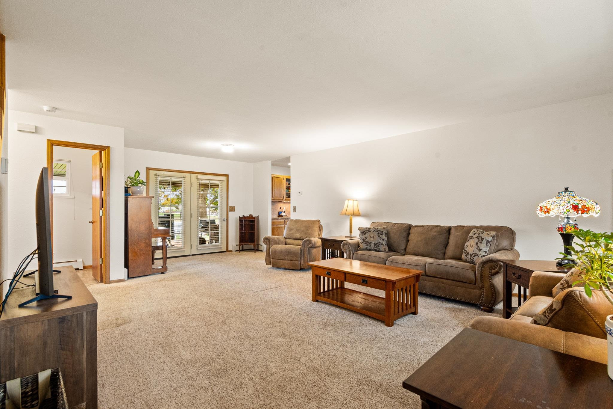 1185-17 17 1/2 Road Fruita, CO 81521 - Photo 6 of 35 a living room with furniture and a flat screen tv