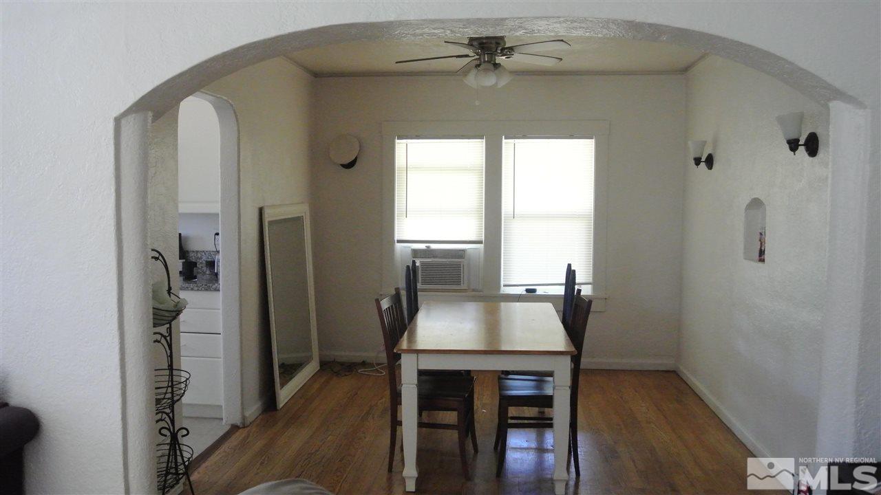 1144 Codel Way Reno, NV 89503 - Photo 4 of 4 a workspace with chandelier and wooden floor