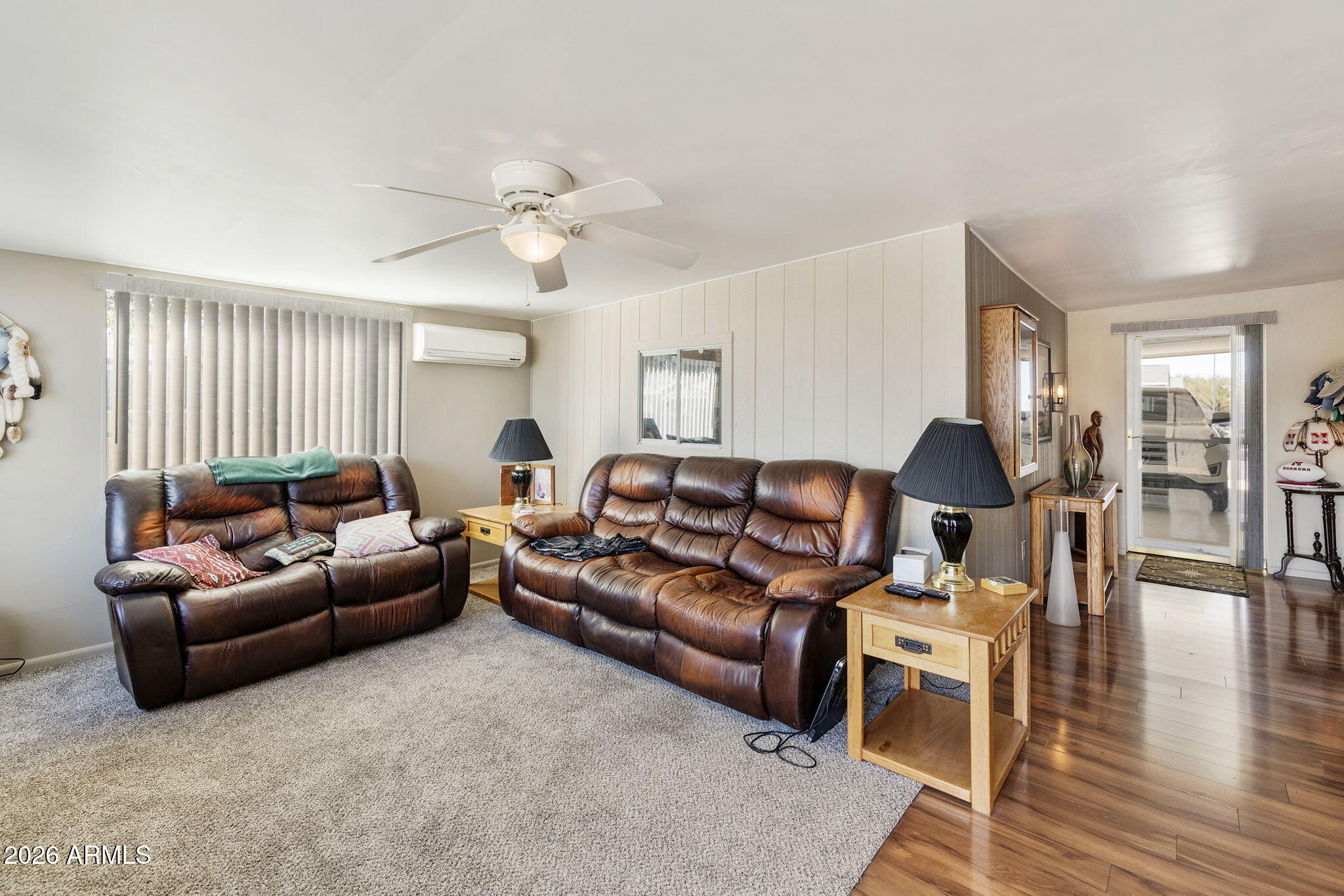 3700 South Tomahawk Road, Unit 23 Apache Junction, AZ 85119 - Photo 5 of 31 a living room with furniture and wooden floor