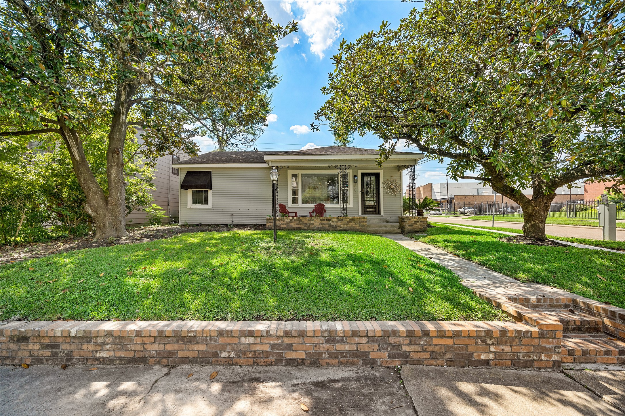 a front view of house with yard and green space