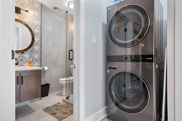 a bathroom with a toilet mirror and sink