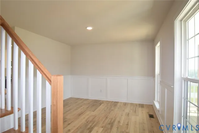 a view of an empty room and glass door