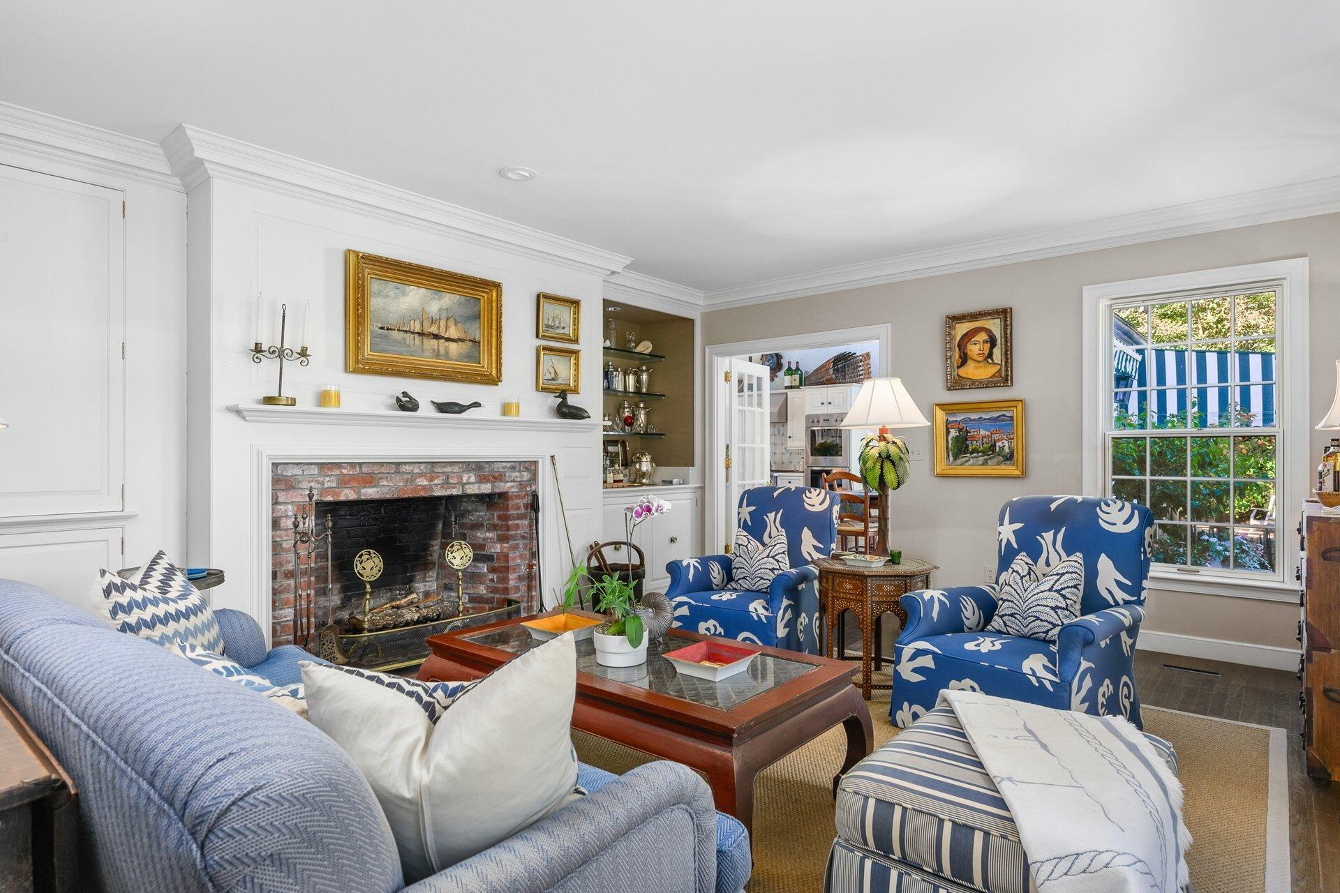 245 North Bay Road Osterville, MA 02655 - Photo 15 of 50 a living room with furniture and a fireplace