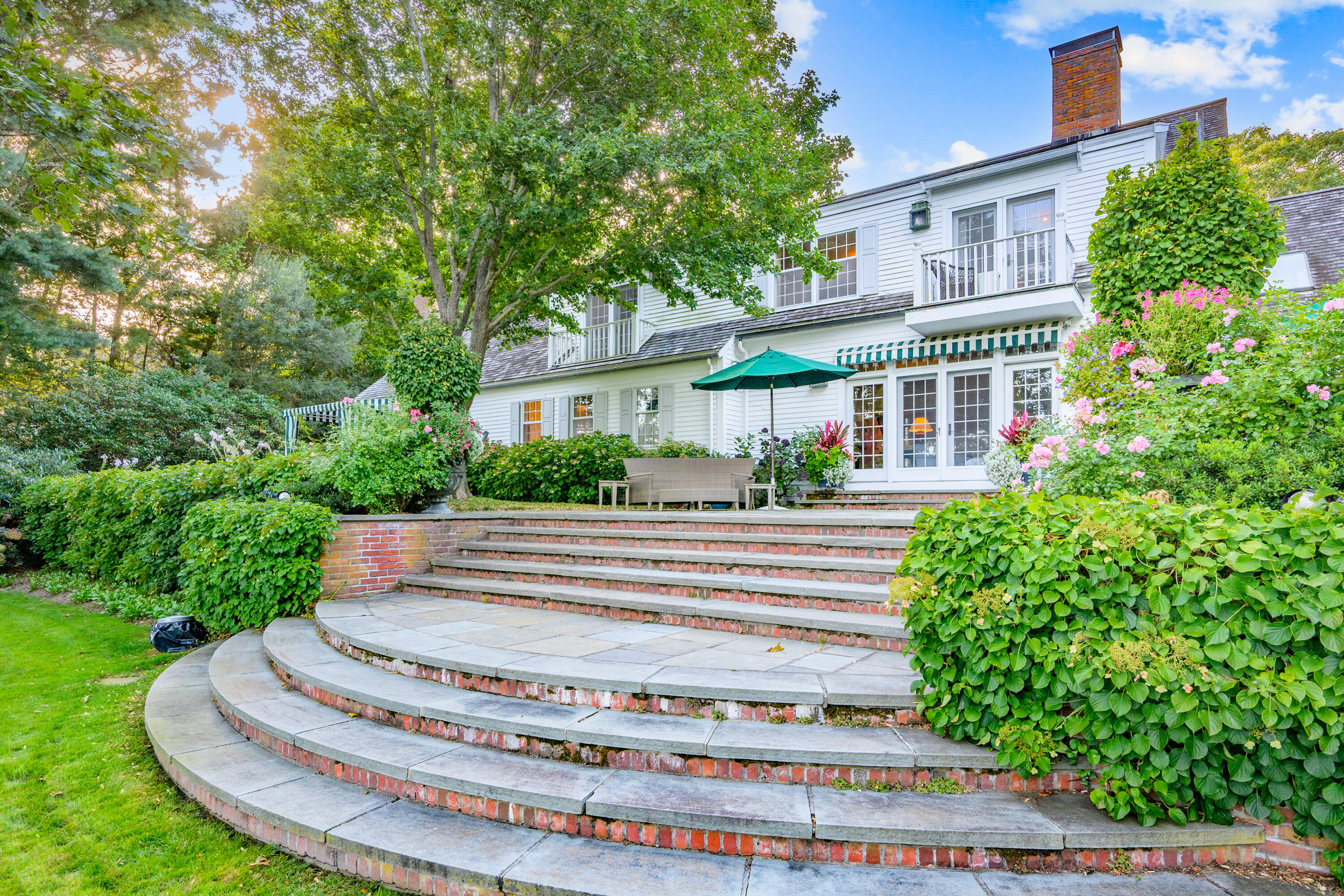 245 North Bay Road Osterville, MA 02655 - Photo 17 of 50 a front view of a house with a yard