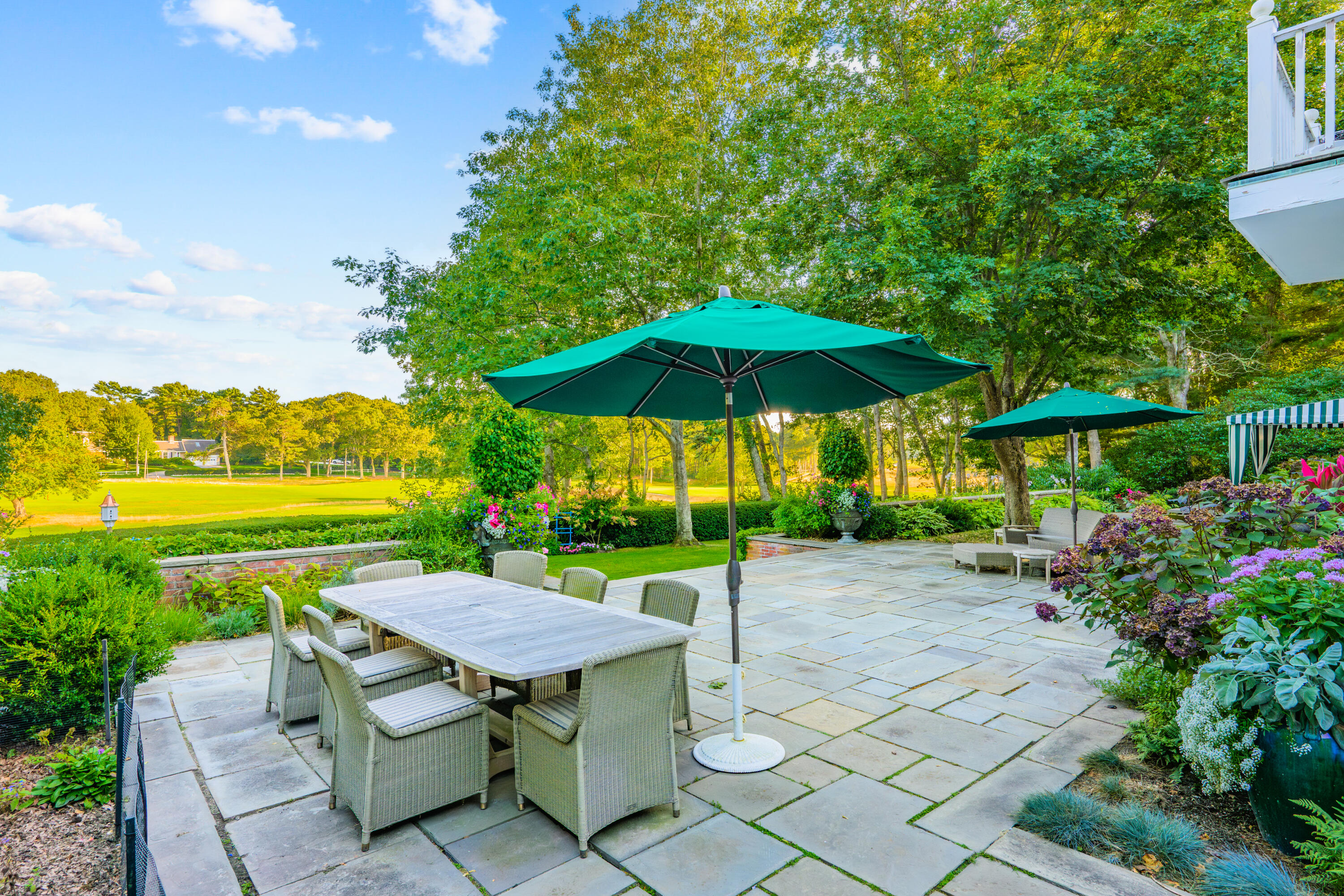 245 North Bay Road Osterville, MA 02655 - Photo 21 of 50 a view of backyard with outdoor seating and trees