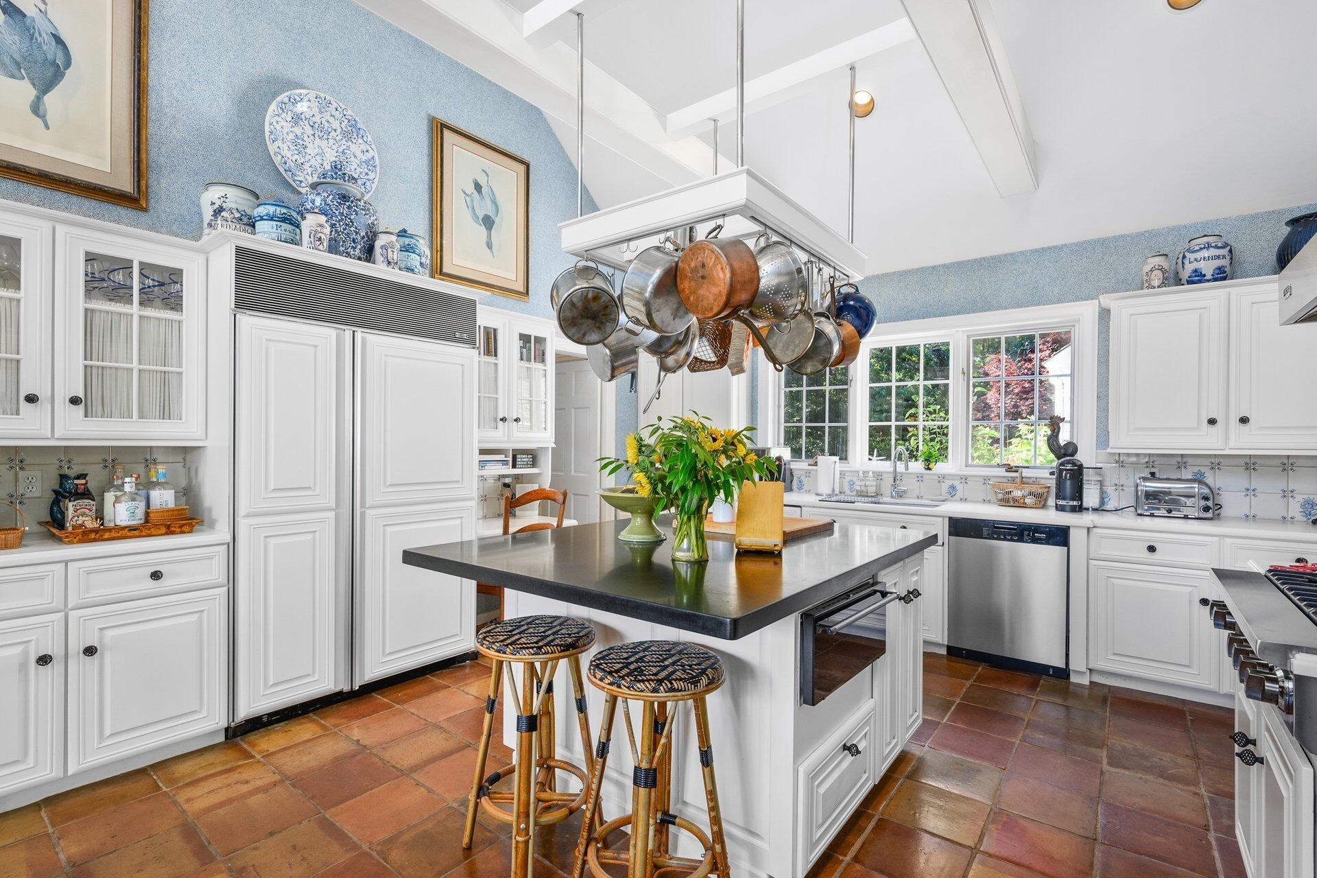 245 North Bay Road Osterville, MA 02655 - Photo 25 of 50 a kitchen with stainless steel appliances kitchen island granite countertop a table and chairs in it