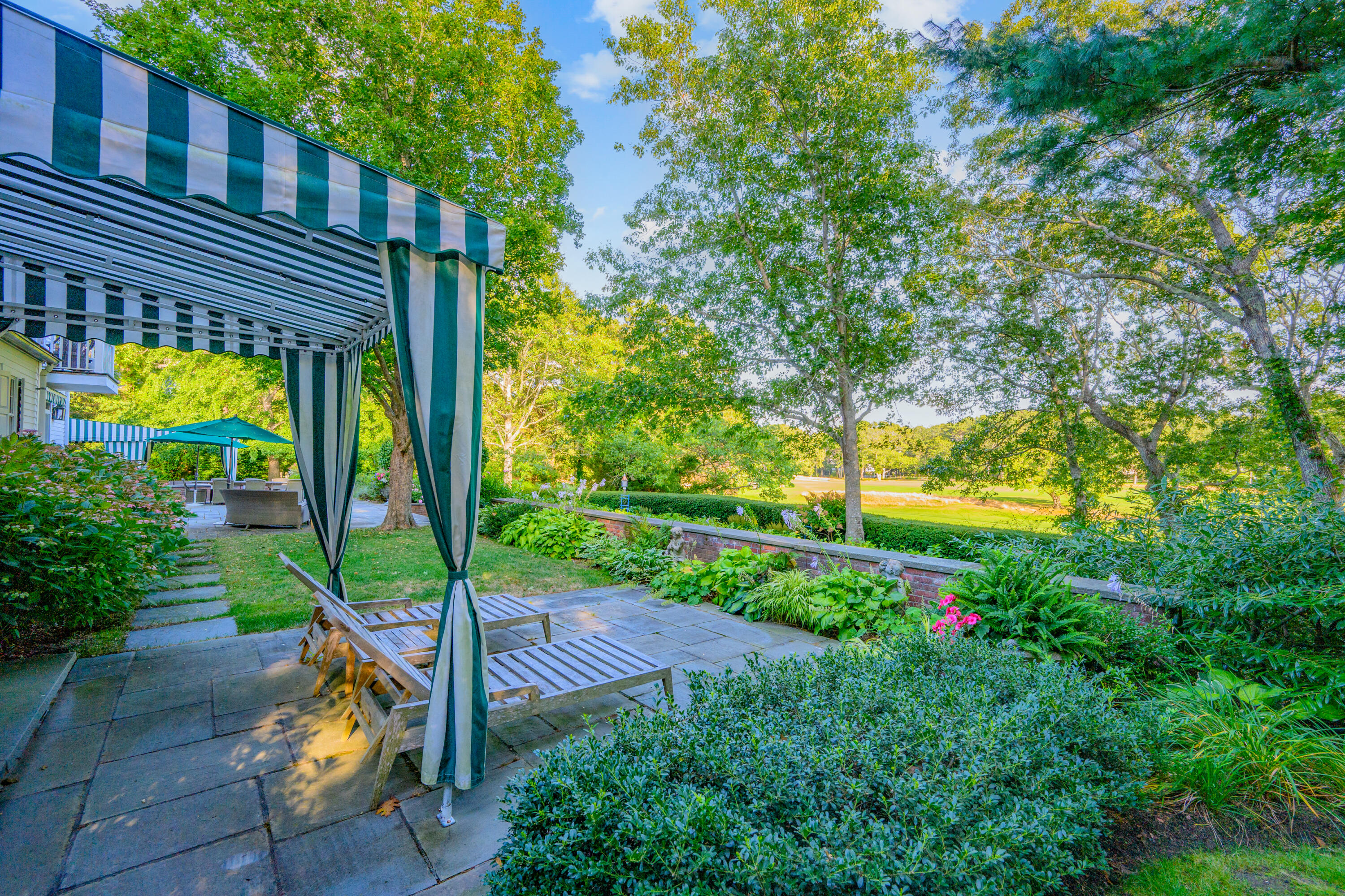 245 North Bay Road Osterville, MA 02655 - Photo 28 of 50 a view of a house with backyard and sitting area