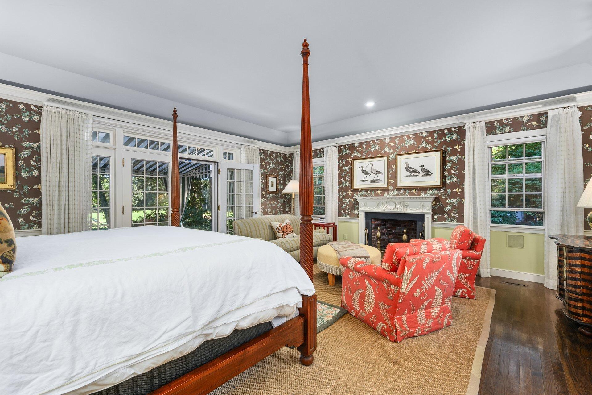 245 North Bay Road Osterville, MA 02655 - Photo 29 of 50 a bed room with a bed and a fireplace