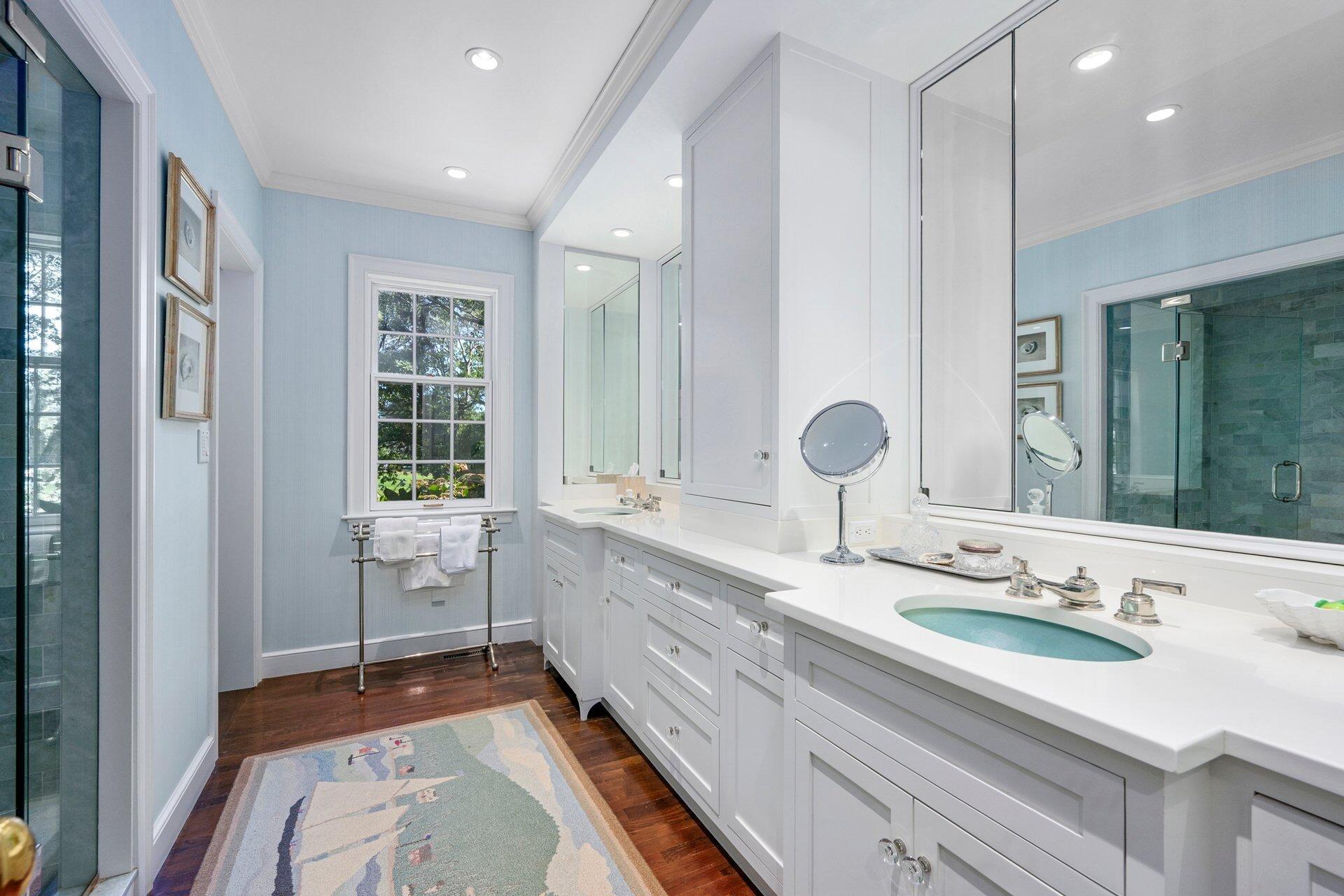 245 North Bay Road Osterville, MA 02655 - Photo 30 of 50 a bathroom with a double vanity sink a mirror and a bathtub