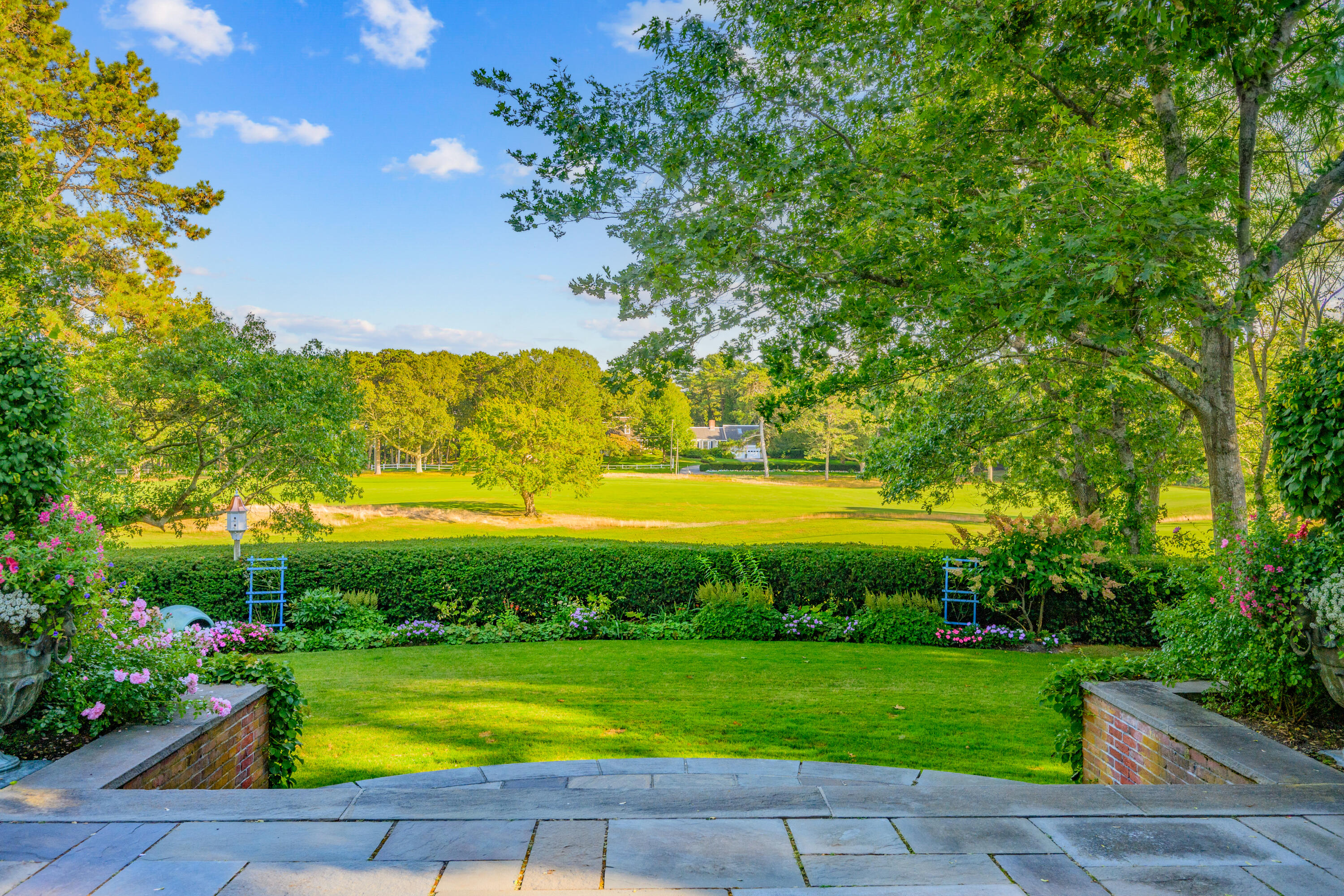 245 North Bay Road Osterville, MA 02655 - Photo 3 of 50 a view of a swimming pool with a yard and a garden