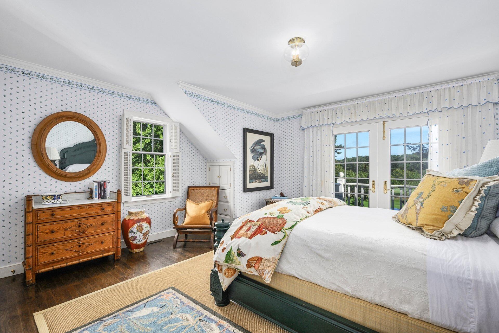 245 North Bay Road Osterville, MA 02655 - Photo 31 of 50 a bedroom with a bed a couch and dresser