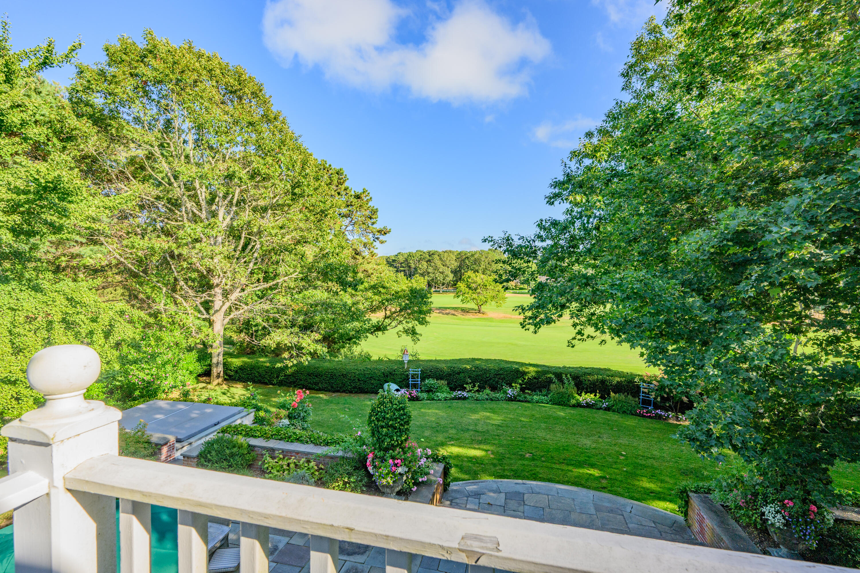 245 North Bay Road Osterville, MA 02655 - Photo 32 of 50 a view of a backyard with table and chairs plants and large trees