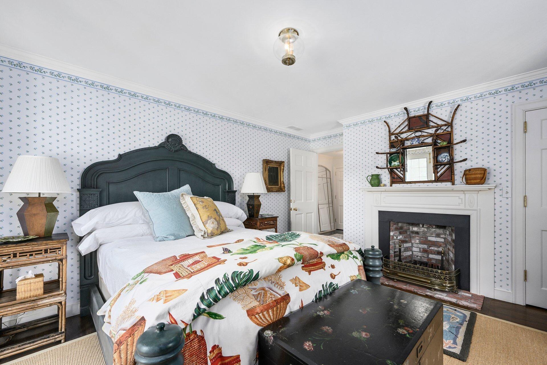 245 North Bay Road Osterville, MA 02655 - Photo 33 of 50 a bedroom with a bed and a fireplace