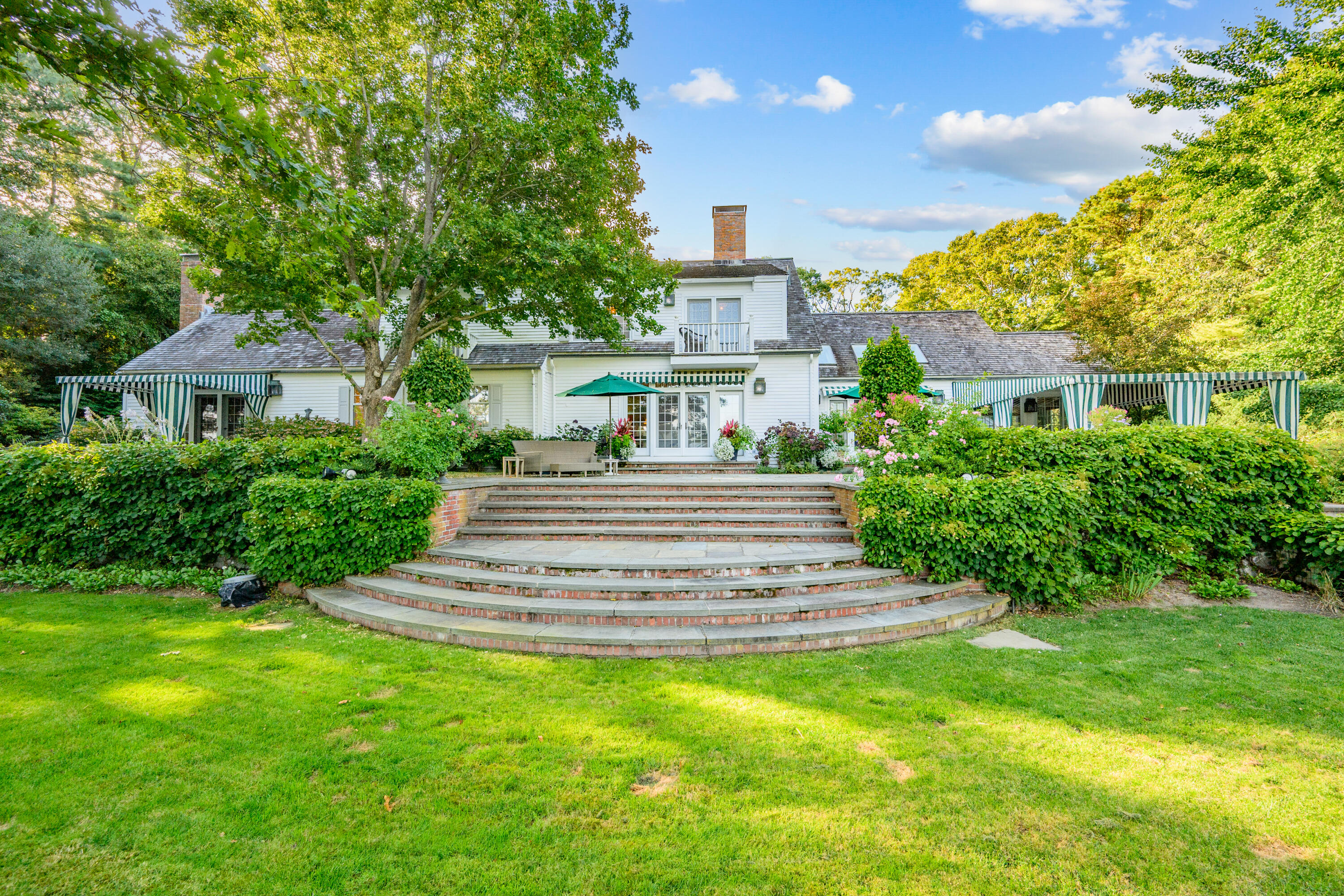 245 North Bay Road Osterville, MA 02655 - Photo 38 of 50 a front view of a house with a yard