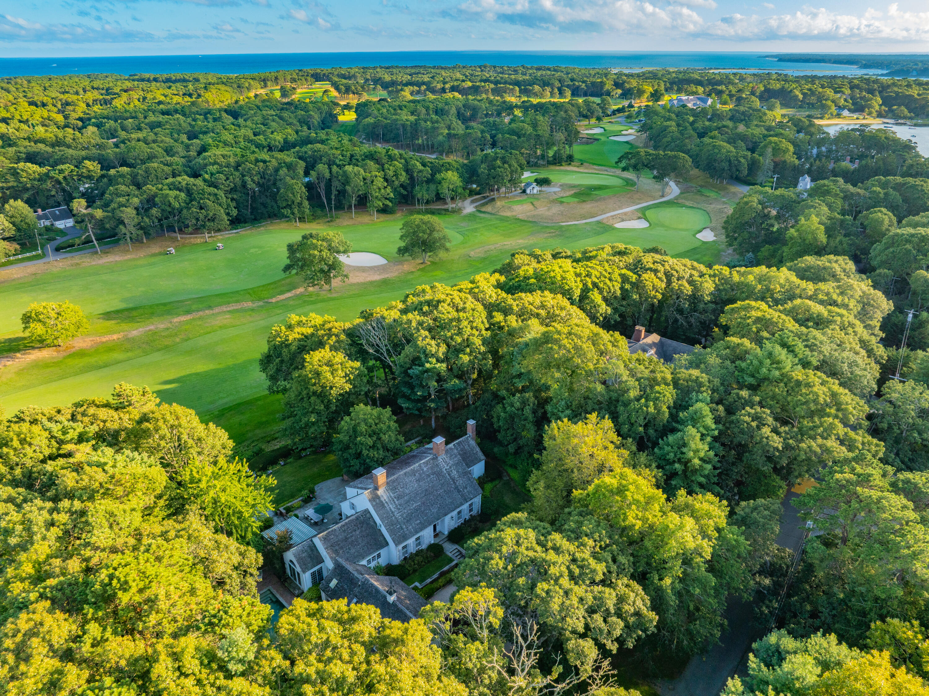 245 North Bay Road Osterville, MA 02655 - Photo 43 of 50 a view of a garden with a lake