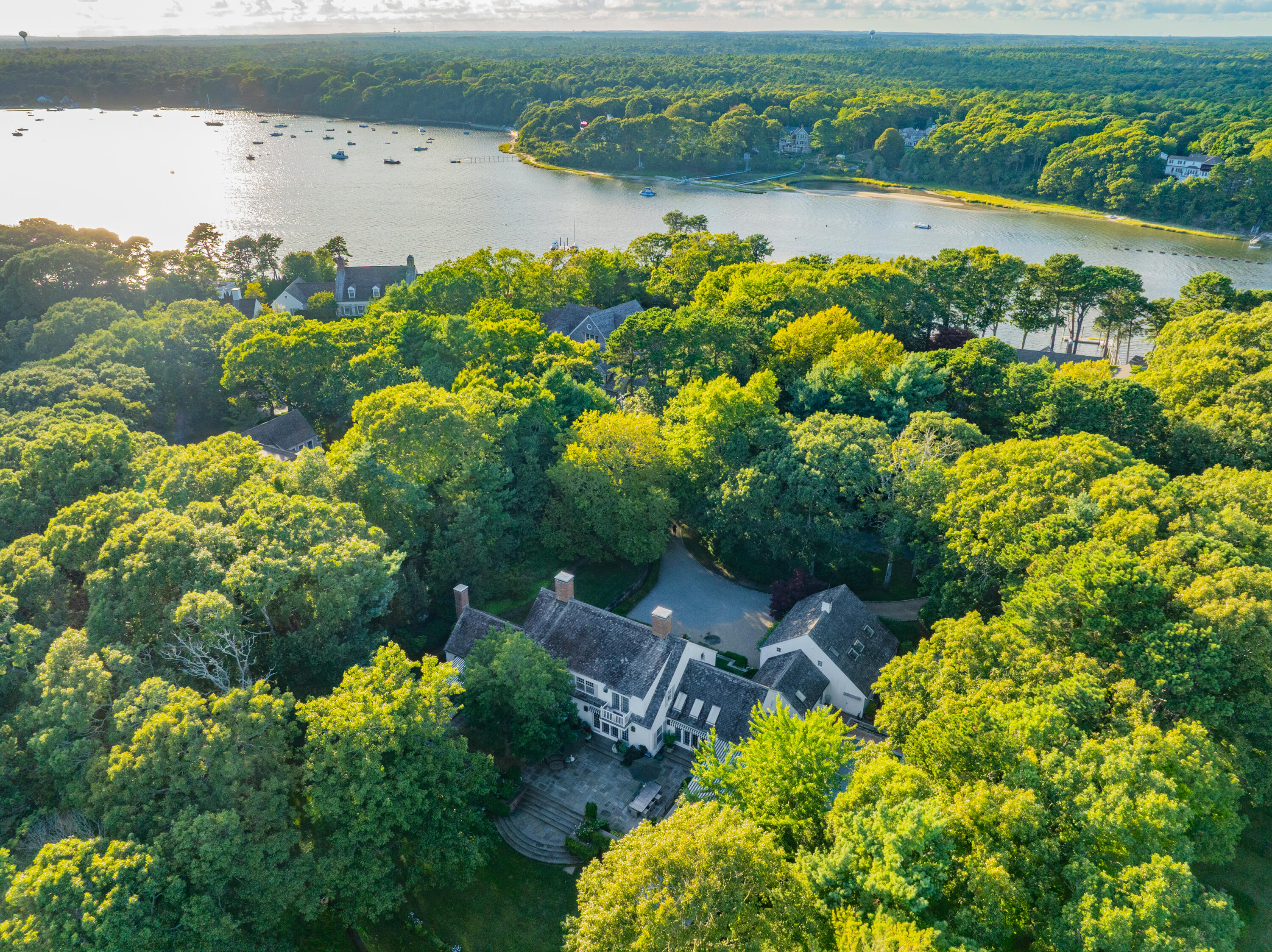 245 North Bay Road Osterville, MA 02655 - Photo 45 of 50 a view of a lake with a flower and a yard