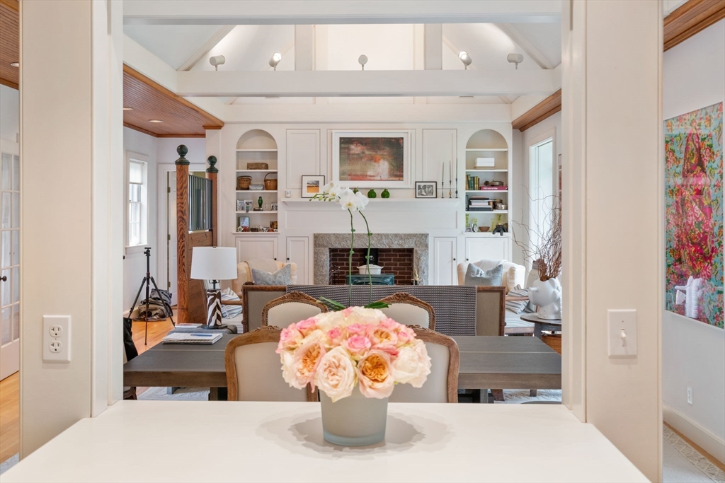 164 Forest Street, Unit 164 Sherborn, MA 01770 - Photo 11 of 32 a bedroom with furniture and a fireplace