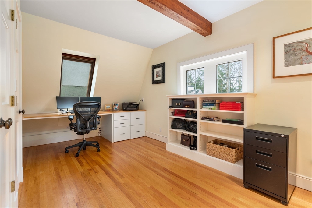 164 Forest Street, Unit 164 Sherborn, MA 01770 - Photo 20 of 32 a view of a workspace with furniture and wooden floor